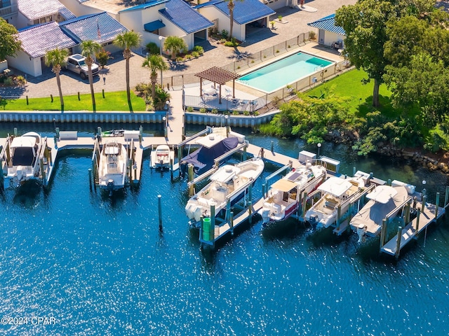 birds eye view of property with a water view