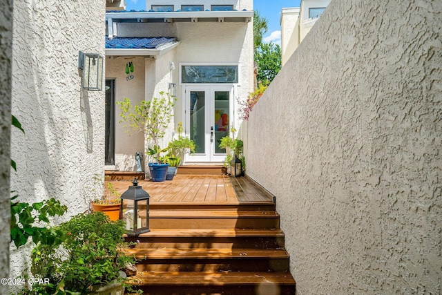 doorway to property with french doors and a deck