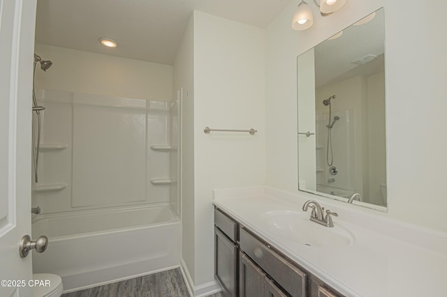 bathroom with vanity, wood-type flooring, and toilet