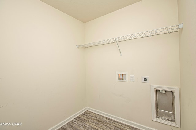 laundry room with electric dryer hookup, washer hookup, and hardwood / wood-style floors