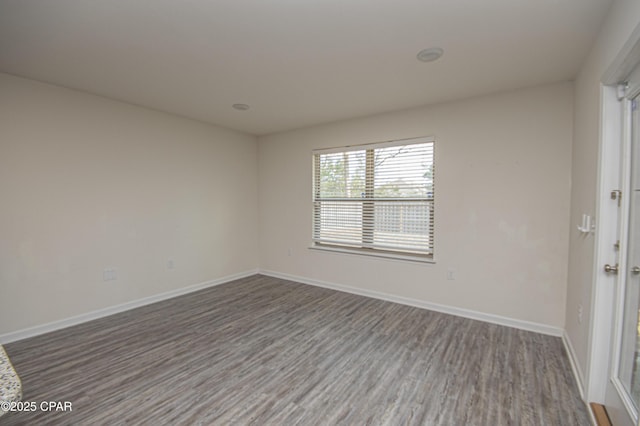 spare room featuring hardwood / wood-style flooring