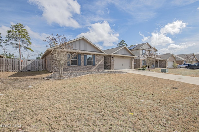 view of front of house with a garage and a front lawn