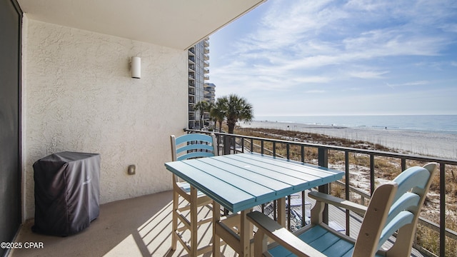 balcony with a view of the beach and a water view