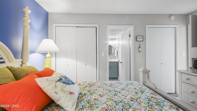 bedroom with connected bathroom and a textured ceiling