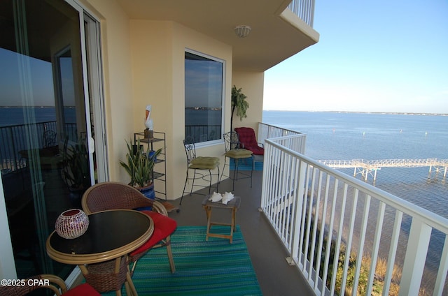 balcony featuring a water view