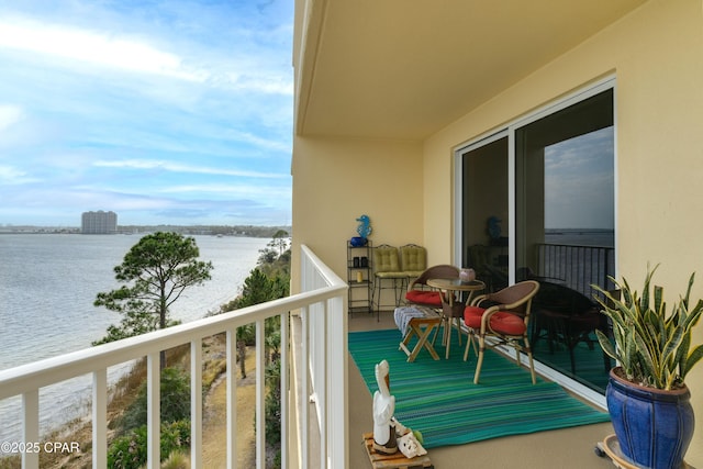 balcony featuring a water view