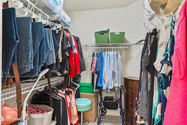 spacious closet with wood finished floors