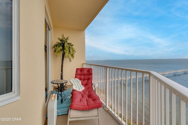 balcony featuring a water view