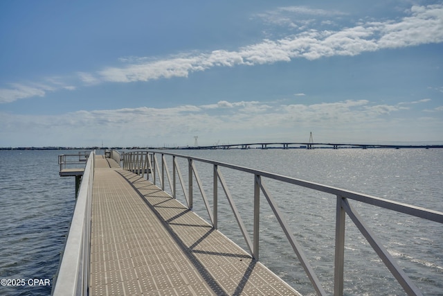 dock area with a pier and a water view