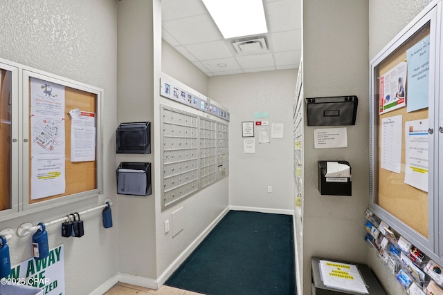 view of home's community featuring mail area and visible vents