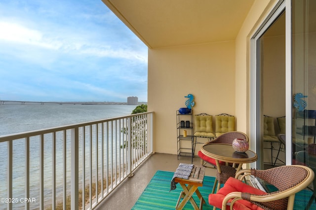 balcony featuring a water view