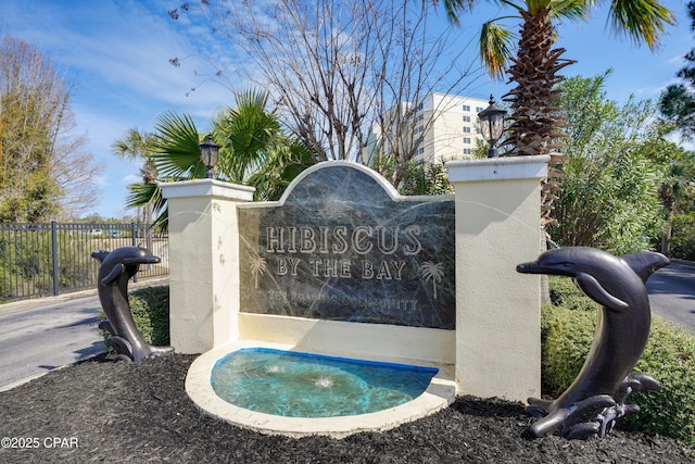 community sign with fence