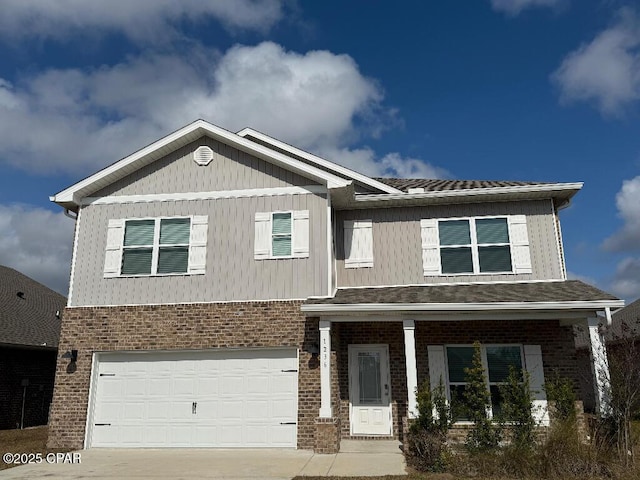 view of front facade featuring a garage, concrete driveway, and brick siding