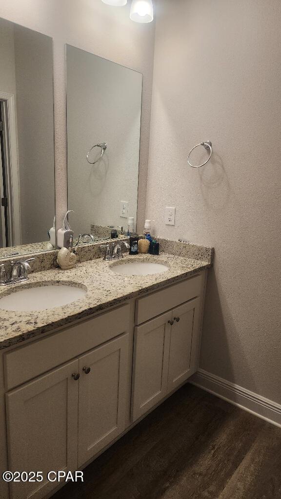 bathroom with vanity and hardwood / wood-style floors