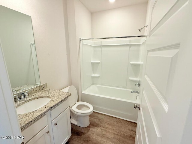 full bathroom with toilet, vanity, bathtub / shower combination, and wood finished floors