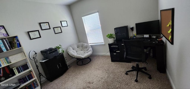 carpeted home office featuring baseboards