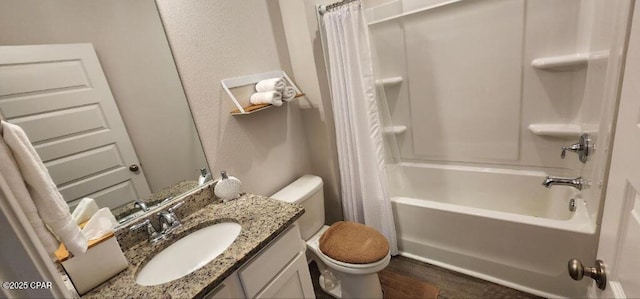 full bathroom featuring vanity, hardwood / wood-style floors, shower / bath combination with curtain, and toilet