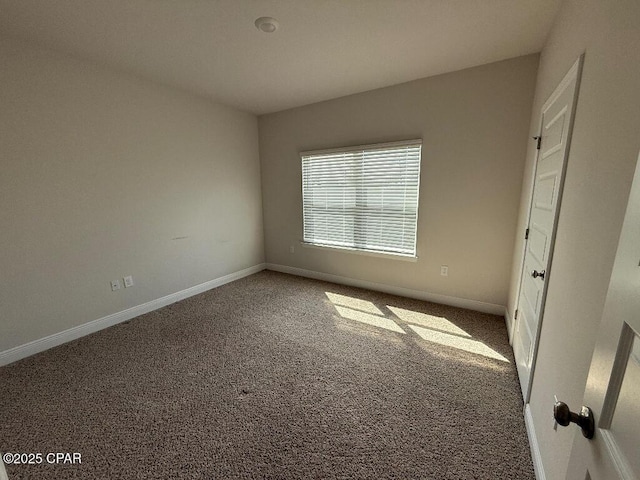 unfurnished bedroom with carpet and baseboards