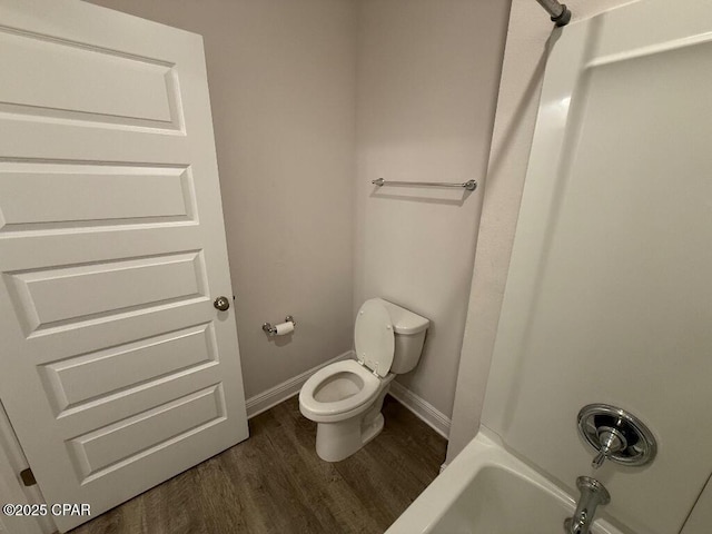 full bath featuring baseboards, toilet, and wood finished floors