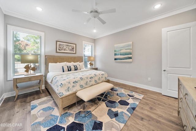 bedroom featuring ornamental molding, wood finished floors, and baseboards