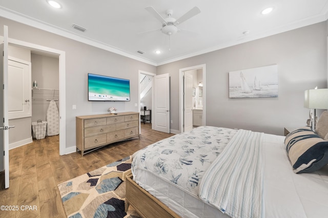 bedroom with crown molding, recessed lighting, visible vents, wood finished floors, and baseboards