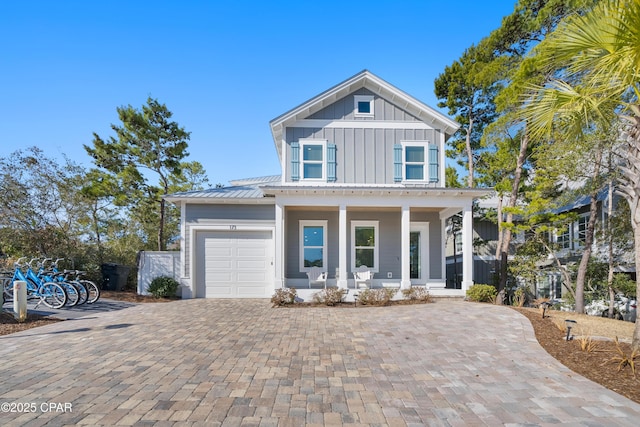 view of front of home with a garage and covered porch