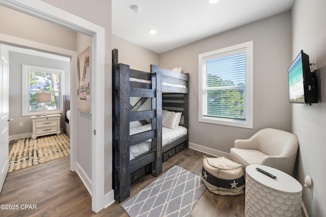 bedroom featuring recessed lighting, dark wood finished floors, and baseboards