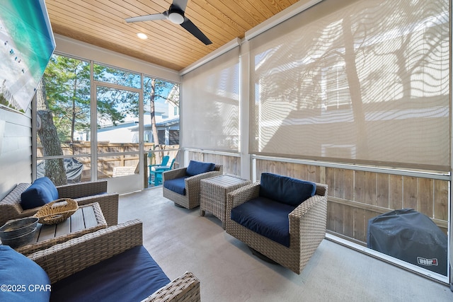 sunroom / solarium with wood ceiling and ceiling fan