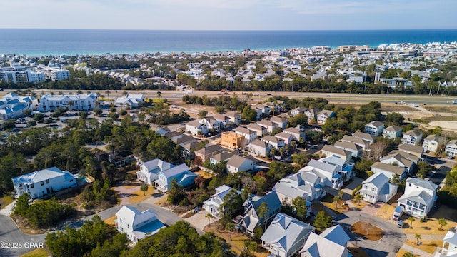 birds eye view of property with a residential view and a water view