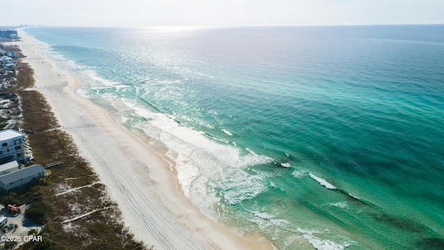 drone / aerial view with a water view and a view of the beach