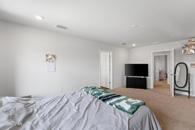 bedroom featuring light carpet