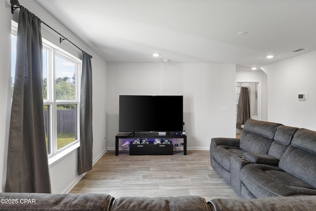 living room with light hardwood / wood-style floors