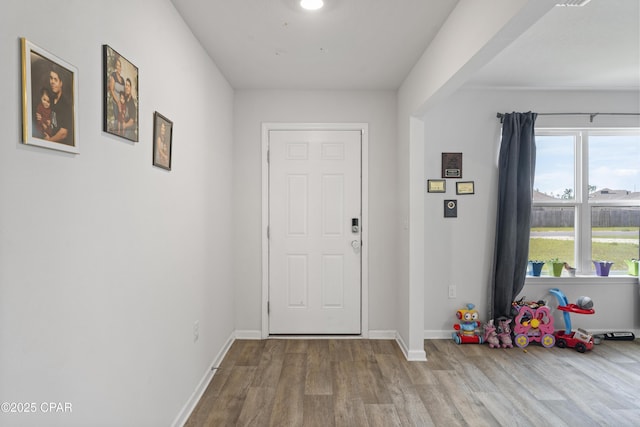 doorway to outside with light hardwood / wood-style floors