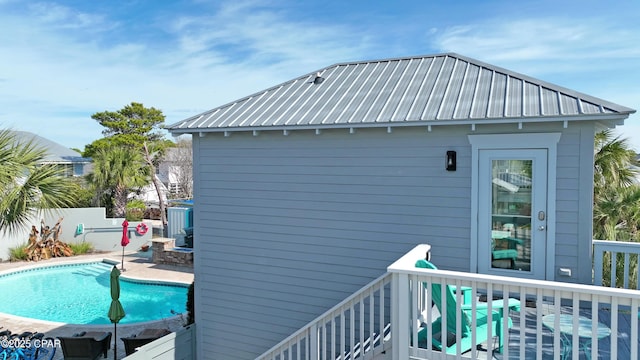 exterior space featuring a fenced in pool