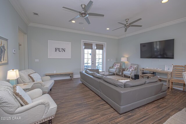 living room with crown molding, dark wood-type flooring, french doors, and ceiling fan