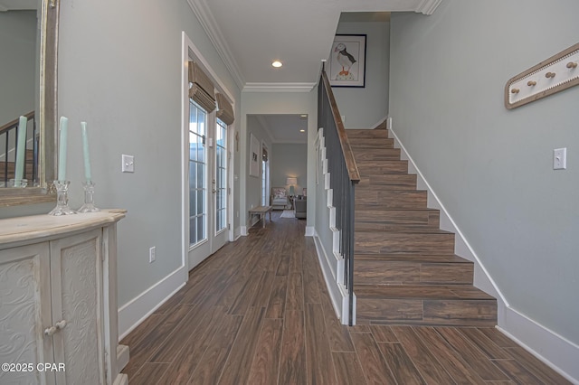 entryway with crown molding and dark hardwood / wood-style flooring