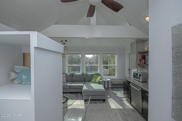 living room featuring hardwood / wood-style flooring, vaulted ceiling, wooden ceiling, and ceiling fan