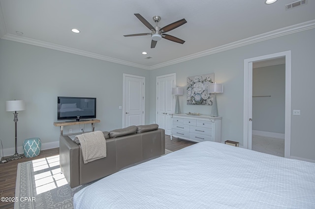 bedroom featuring hardwood / wood-style flooring and ornamental molding