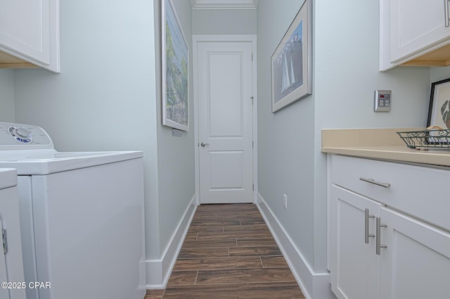 washroom featuring cabinets, washer / dryer, and dark hardwood / wood-style floors