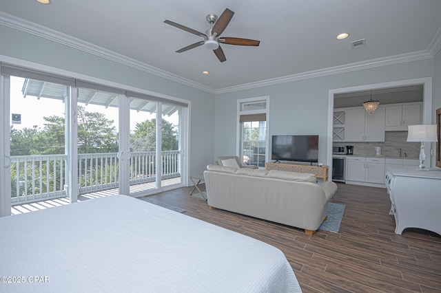 bedroom featuring sink, dark hardwood / wood-style flooring, access to outside, ceiling fan, and crown molding