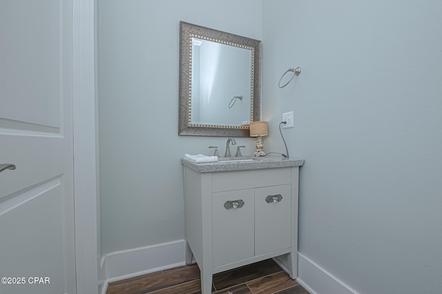 bathroom featuring vanity and wood-type flooring