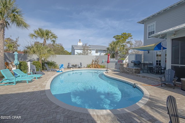 view of pool featuring a patio