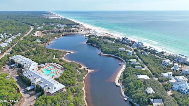 bird's eye view featuring a water view and a beach view