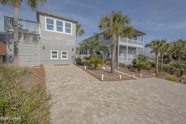 rear view of house featuring a balcony