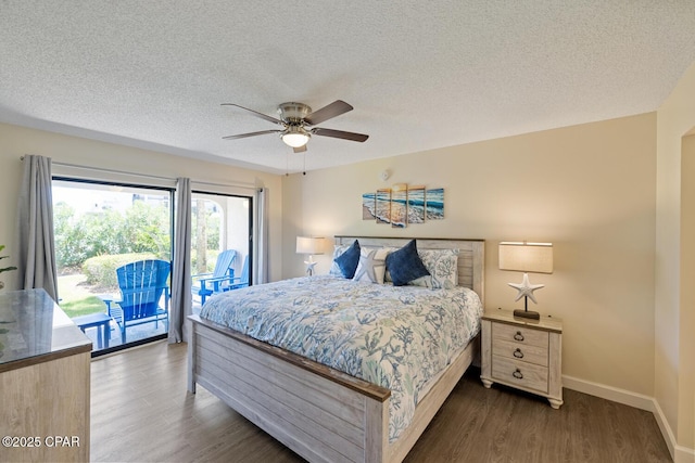 bedroom with dark hardwood / wood-style flooring, access to exterior, a textured ceiling, and ceiling fan