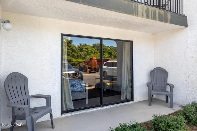 doorway to property featuring a balcony