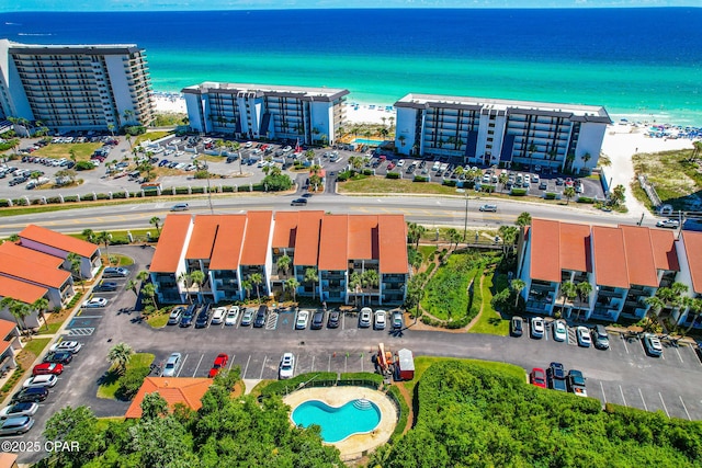 bird's eye view featuring a beach view and a water view