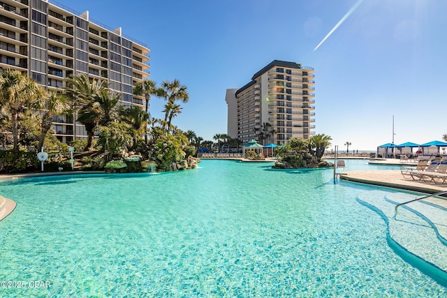 view of swimming pool with pool water feature