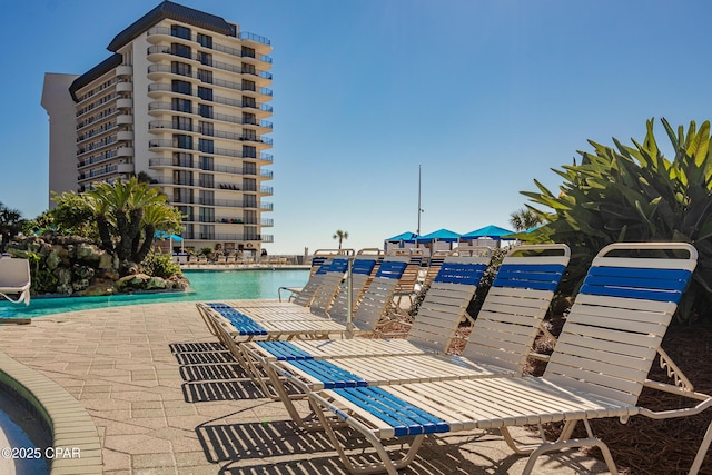 view of pool featuring a patio