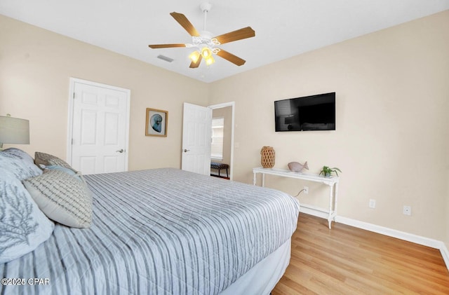 bedroom featuring ceiling fan and light wood-type flooring